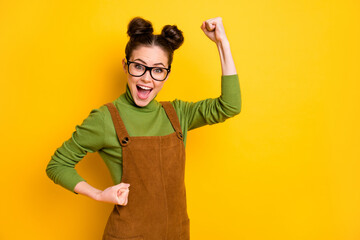 Poster - Photo of delighted girl raise fists scream enjoy rejoice good grades courses lesson test wear green jumper isolated over bright shine color background