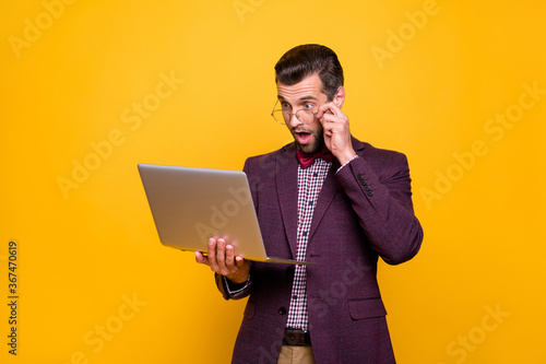 Photo of handsome rich clothes outfit guy hold notebook hands read news email startup success investment money income wear specs plaid shirt blazer isolated yellow color background