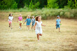 © master1305 - Kids, children running on meadow in summer's sunlight. Look happy, cheerful with sincere bright emotions. Cute caucasian boys and girls. Concept of childhood, happiness, movement, family and summer.