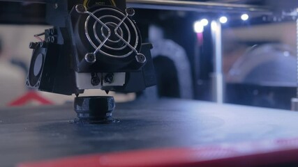 Automatic three dimensional 3D printer machine printing plastic model at modern technology exhibition - close up. 3D printing, additive technologies, 4.0 industrial revolution, futuristic concept