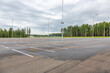 Empty free outdoor parking near the shopping mall on a cloudy summer day