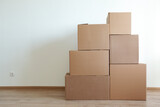Fototapeta Mapy - Cardboard boxes for moving in interior apartment,