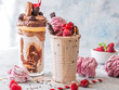 Chocolate indulgent frosting exreme milkshake with donut  and sweets. Crazy freakshake food trend. Copy space
