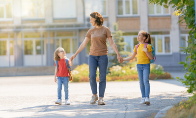 Wall Mural - Parent and pupils go to school