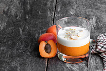 Layered Dessert In Glass With Apricot Jelly With Vanilla Mousse