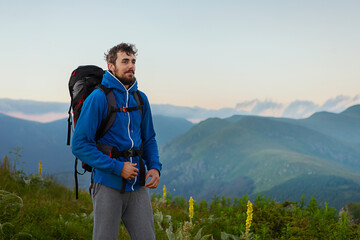 Man hiking in the mountains on a summer day