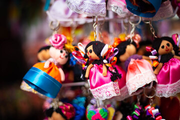 Wall Mural - A group of colorful mexican dolls. muñecas mexicanas. queretaro mexico. Canasta mexicana. tradiciones. 
Basket full of mexican dolls 