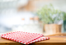 Red Fabric,cloth On Wood Table Top On Blur Kitchen Counter (room)background