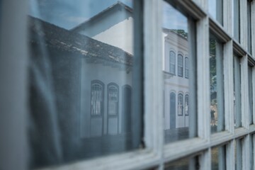 Wall Mural - Closeup shot of a reflection of a building on windows