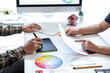 © Thitiphat - Interior graphic designer working sketching on graphic tablet and color swatch