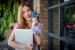 © Wutthichai - Beautiful woman showing two credit cards