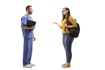 Wall Mural - Full length profile shot of a male healthcare worker talking with a female student