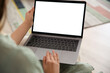 © New Africa - Woman using laptop at home, closeup. Space for design