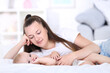 © 5second - Young mother with baby boy lying on bed