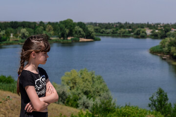 The girl admires the beautiful view of the banks of the Dnieper. Travel healthy lifestyle