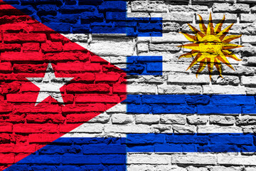 Flag of Cuba and Uruguay on brick wall