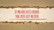 © MarekPhotoDesign.com - It never gets easier, you just get better - inspirational handwriting on handmade paper, business, education and personal development concept, web banner