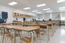 Desks In A Row In Empty High School Classroom