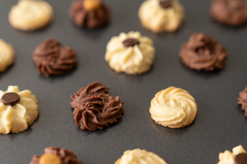 Wall Mural - Homemade assorted chocolate bite size butter cookies on baking tray