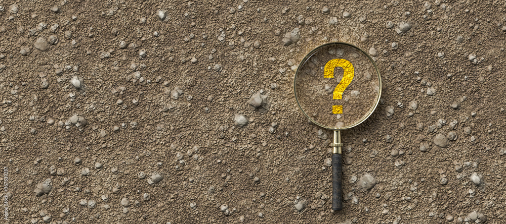 magnifying glass with question mark on dirt gravel background - obrazy, fototapety, plakaty 