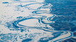 An aerial view of a  winding river on a cold winter morning near Nome, Alaska.
