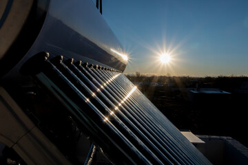 Wall Mural - solar hot water tank at sunset