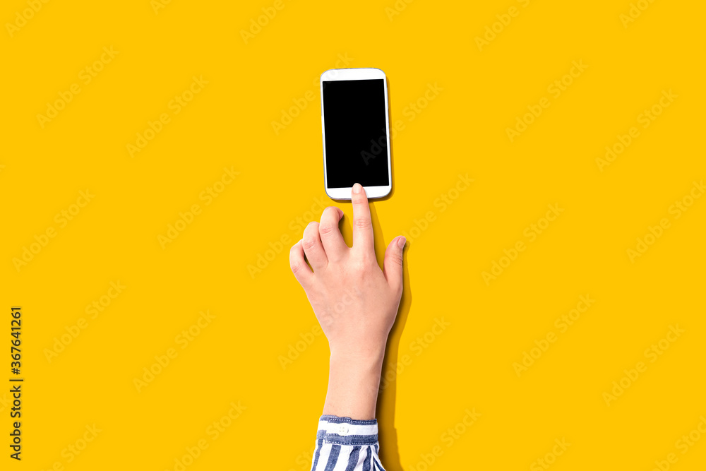 Person using a white smartphone from above - obrazy, fototapety, plakaty 