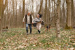 © prostooleh - Seniors in a forest. People walks. Family with dog.