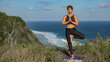 © alexzhilkin - Young woman doing yoga outdoors with amazing back view. Bali. Indonesia.