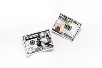 Cutting of US dollar banknote. Economic crisis concept