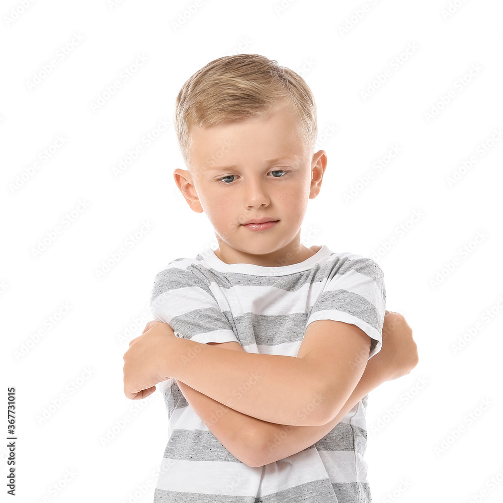 Sad little boy with autistic disorder on white background