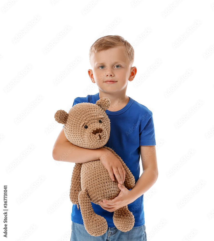 Little boy with autistic disorder and toy on white background