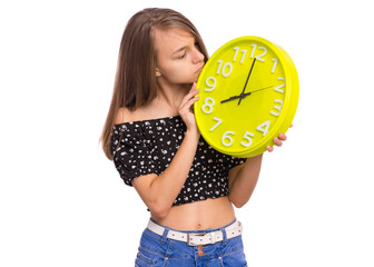 Teen Girl holding Big Clock, isolated on white background. Portrait of caucasian funny teenager showing big clock. Happy Child back to school. Education and time concept.