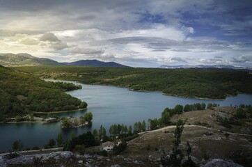 Poster - Aerial shot of a small calm lake in the town of Ruesga, located in Spain