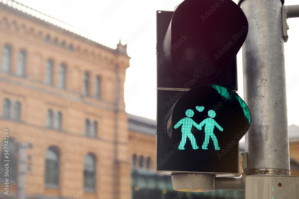Closeup On A Traffic Light That Shows A Green Graphic Of Loving Same closeup-on-a-traffic-light-that-shows-a-green-graphic-of-loving-same