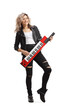 © Ljupco Smokovski - Full length portrait of a cool woman playing a keytar synthesizer and smiling