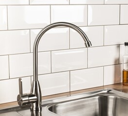 Sticker - New and  modern steel faucet in the kitchen