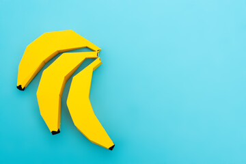 Wall Mural - top view of paper bananas on blue background