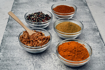 Spices and spices in glass saucers. Cooking and kitchen.