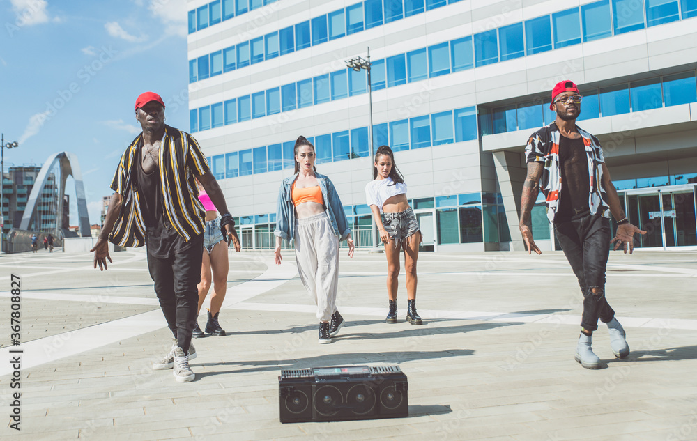 Group of hip hop dancers permorming their dance. - obrazy, fototapety, plakaty 