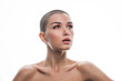 © oneinchpunch - Modern beauty portrait. Young woman with shaved head