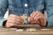 © Andrii Zastrozhnov - A psychologist is holding human brain and puzzle. Problem solving, help. Consultation and treatment of nervous diseases.