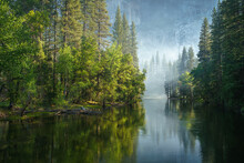 Sunbeams On A Foggy Morning Over Merced River In Yosemite National Park