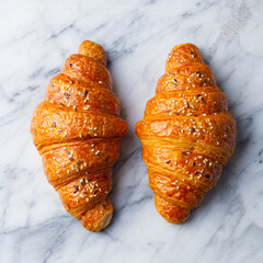 Wall Mural - Croissants on marble table. French traditional pastry. Close up. Top view.