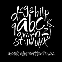 Wall Mural - vector acrylic brush style hand drawn alphabet font. calligraphy alphabet on a black background