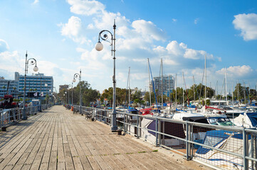 Canvas Print - Wooden pier yachts hotels Cyprus