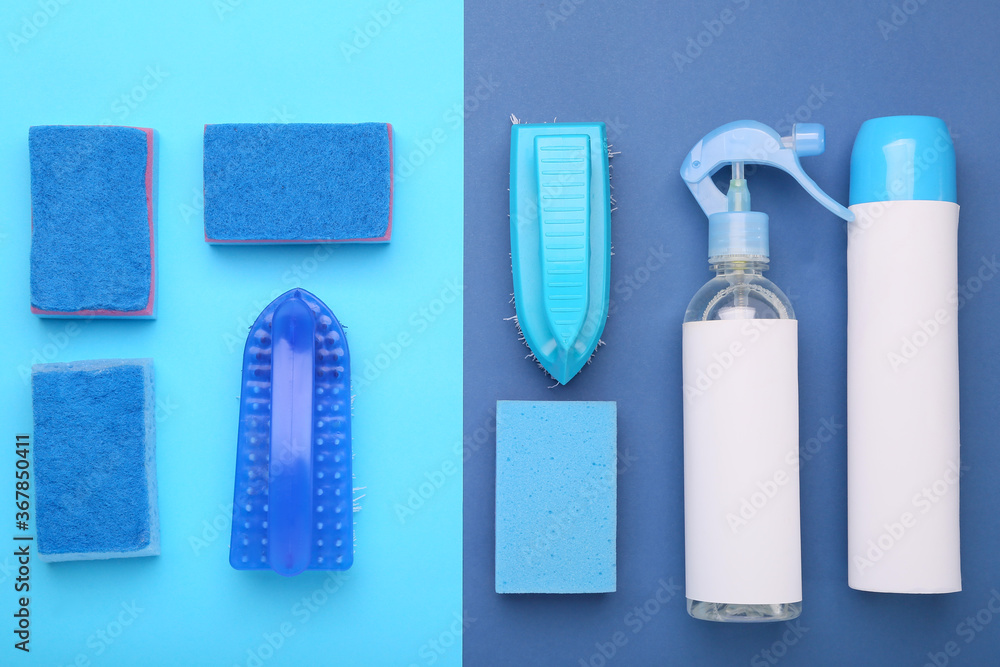 Set of cleaning supplies on color background
