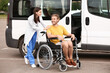 © Pixel-Shot - Doctor and handicapped man near car outdoors