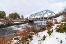 The Blue Bridge Over The Spokane River At Riverfront Park In Downtown Spokane, Washington, Covered In Snow During Winter.
