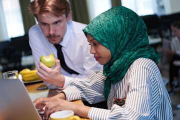 Wall Mural - international multicultural business team working together on laptop